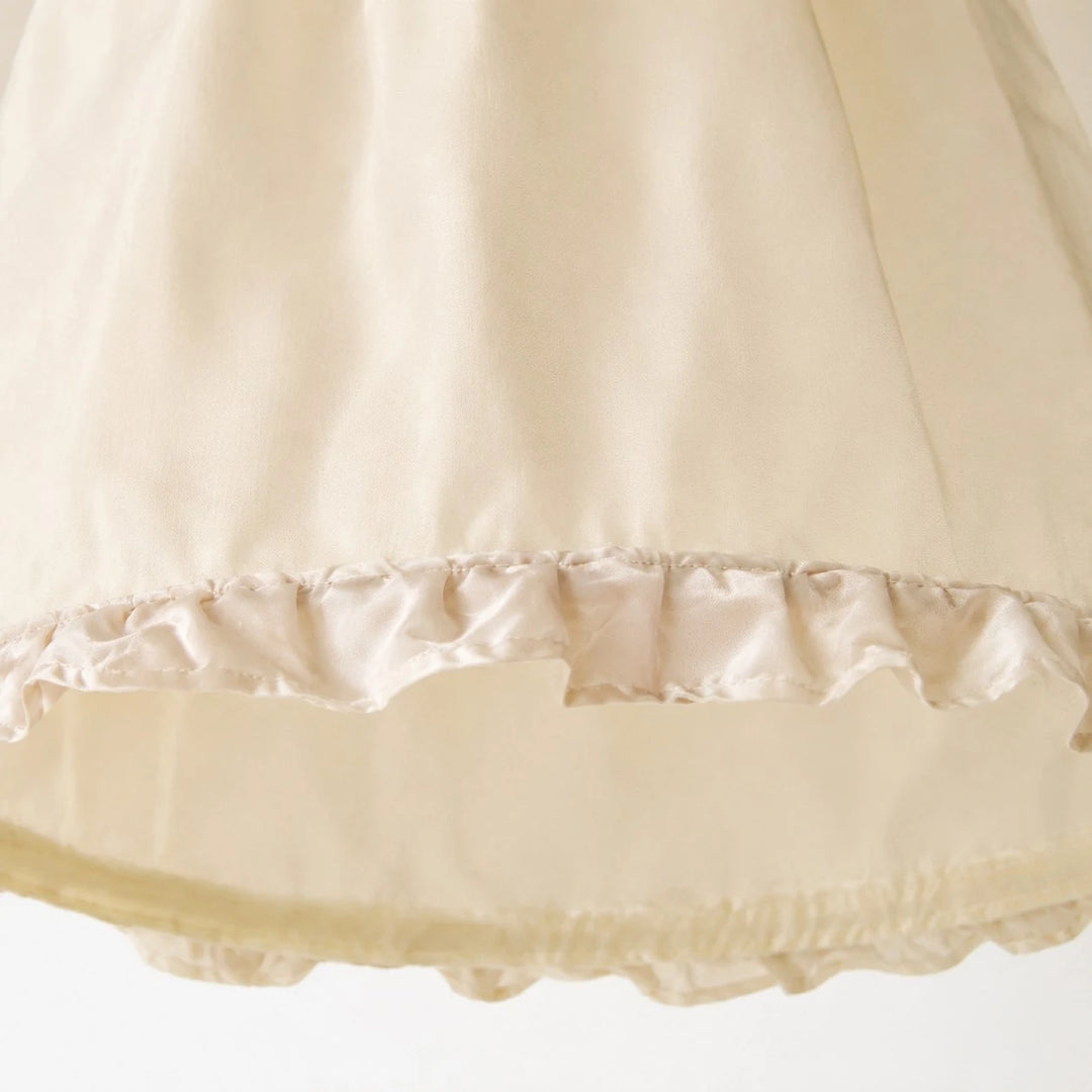 Close view of the softly ruffled fabric shade edge