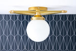 Load image into Gallery viewer, Glorica Glass Geometric Brass Pendant Light - Hand-Blown Globe Design
