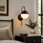 Carica l'immagine nella visualizzazione Galleria, Black milk glass wall lamp beside a bed