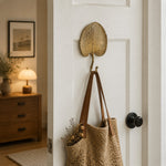 Afbeelding laden in galerijweergave, Botanical wall hook holding a bag on a door