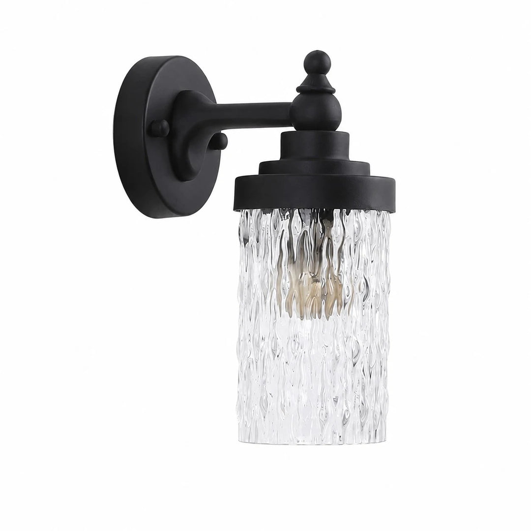 Black metal wall sconce with ribbed clear glass shade