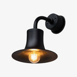 Cargar imagen en el visor de la Galería, Matte black brass wall sconce with warm bulb glow