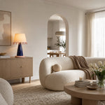 Afbeelding laden in galerijweergave, Sculptural ceramic table lamp on a sideboard in a neutral living room