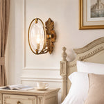 Cargar imagen en el visor de la Galería, Antique brass textured glass wall sconce installed beside a bed