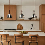 Cargar imagen en el visor de la Galería, Three striped fabric pendant lamps above a warm wood kitchen island
