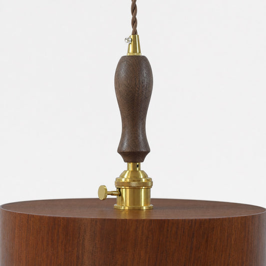 Turned dark wood suspension grip and brass-tone pendant hardware