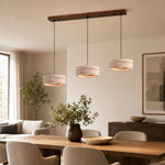 Charger l'image dans la visionneuse de la galerie, Three-light yellow travertine linear LED pendant over a dining table