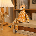 Bild in die Galerieansicht laden, Hand-carved wooden giraffe ornament styled on a tabletop edge