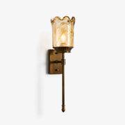Brass amber glass wall sconce on clean background