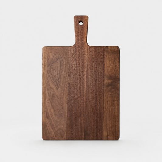 Large black walnut cutting board on a light background