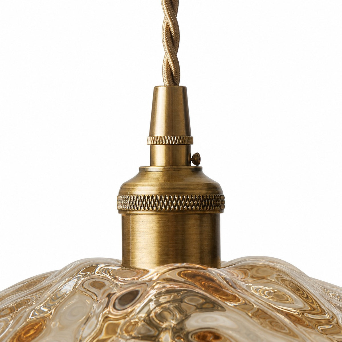 Close-up of antique brass socket and twisted cord