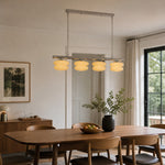 Afbeelding laden in galerijweergave, Cream layered glass chandelier above a wood dining table