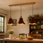 Cargar imagen en el visor de la Galería, Brown triple pendant above a dining table