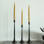Carica l'immagine nella visualizzazione Galleria, Three-piece black iron candle holder set styled with customer-supplied taper candles; candles not included