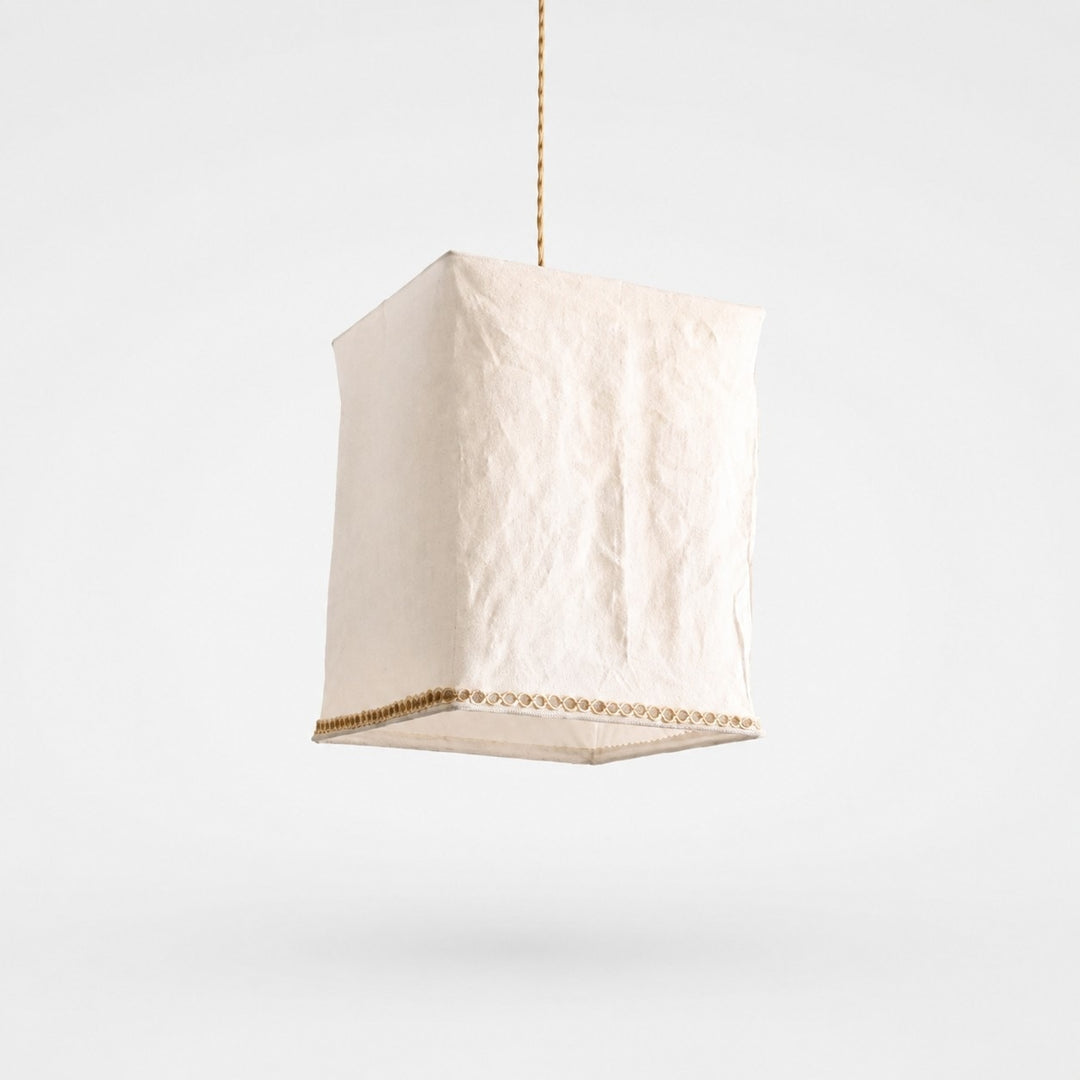 Sculptural linen pendant light on a clean light background