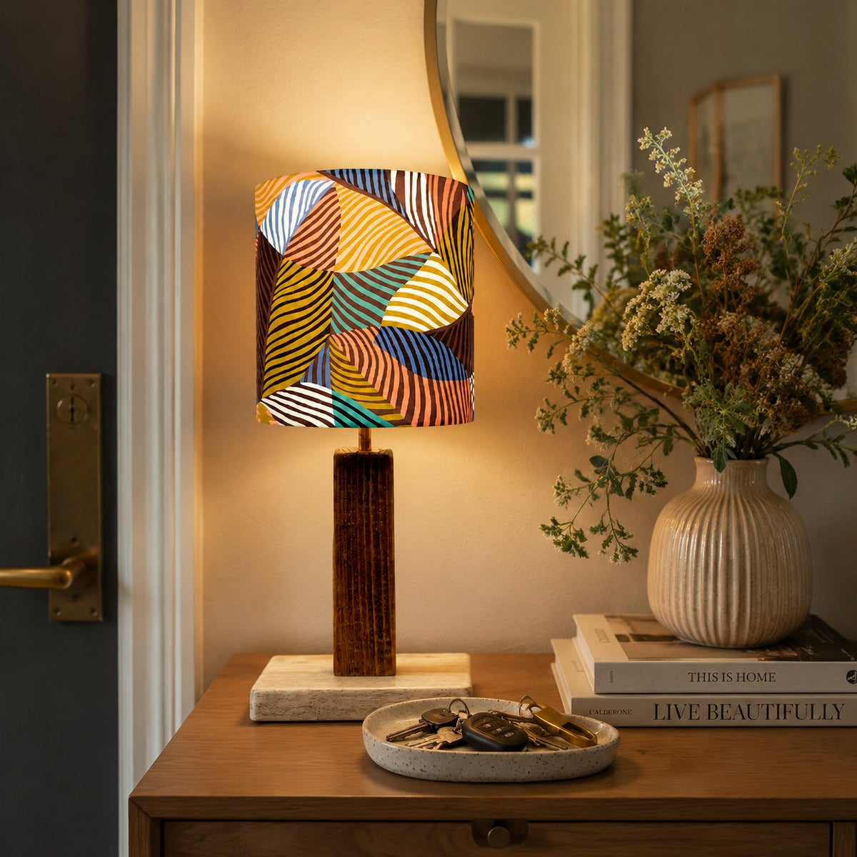 Colorful printed fabric table lamp in a styled interior