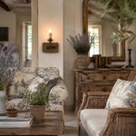Załaduj obraz do przeglądarki galerii, Single rustic candle wall light adding warm ambience in a country style room