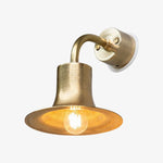 Cargar imagen en el visor de la Galería, Matte gold brass wall sconce with warm bulb glow