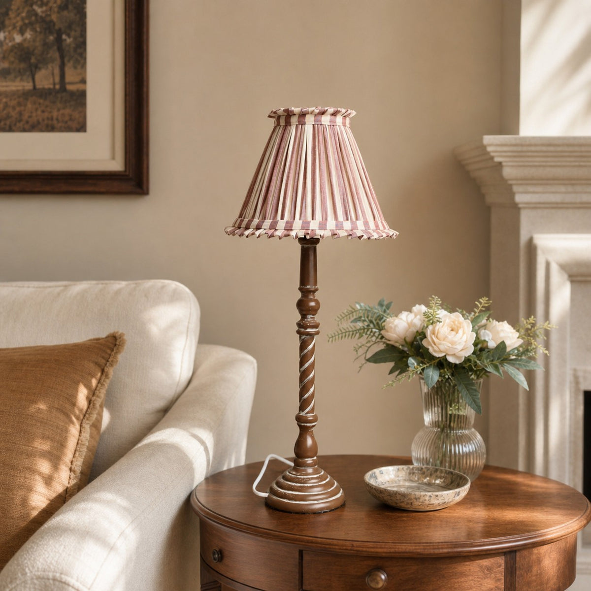 Pink striped French country table lamp in living room side table setting