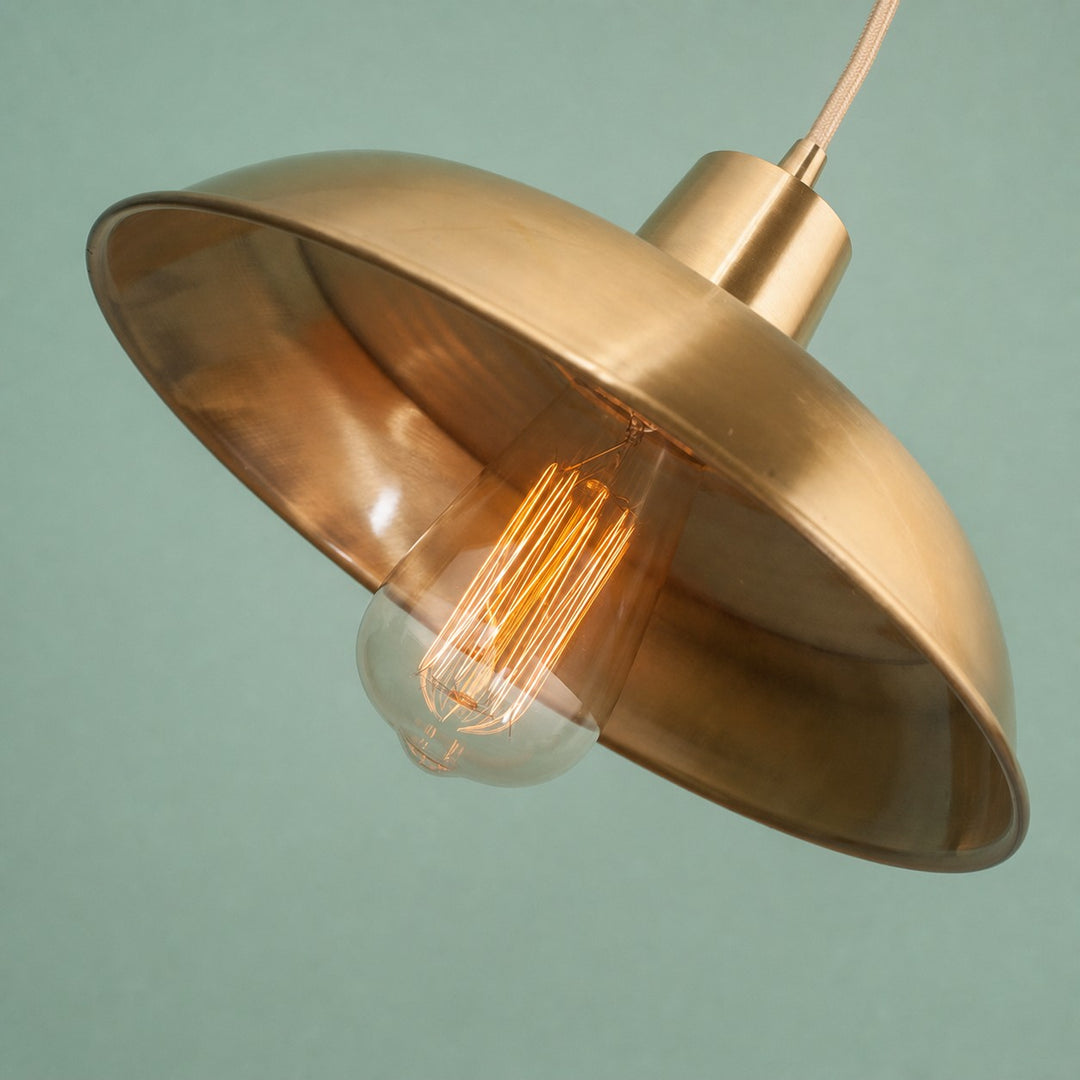 Angled brushed brass pendant shade detail