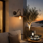 Bild in die Galerieansicht laden, Outdoor wall sconce on a terrace wall at dusk