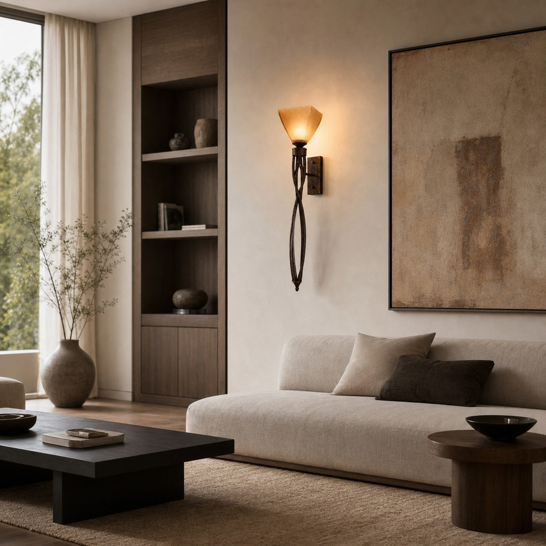 Tall amber glass wall sconce in a neutral living room