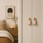 Afbeelding laden in galerijweergave, Cowhide leather and brass cabinet pull handle detail and lifestyle image