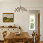 Cargar imagen en el visor de la Galería, Silver palm leaf chandelier above a rustic dining table