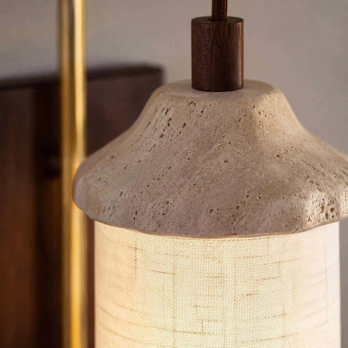 Travertine stone and fabric shade close detail