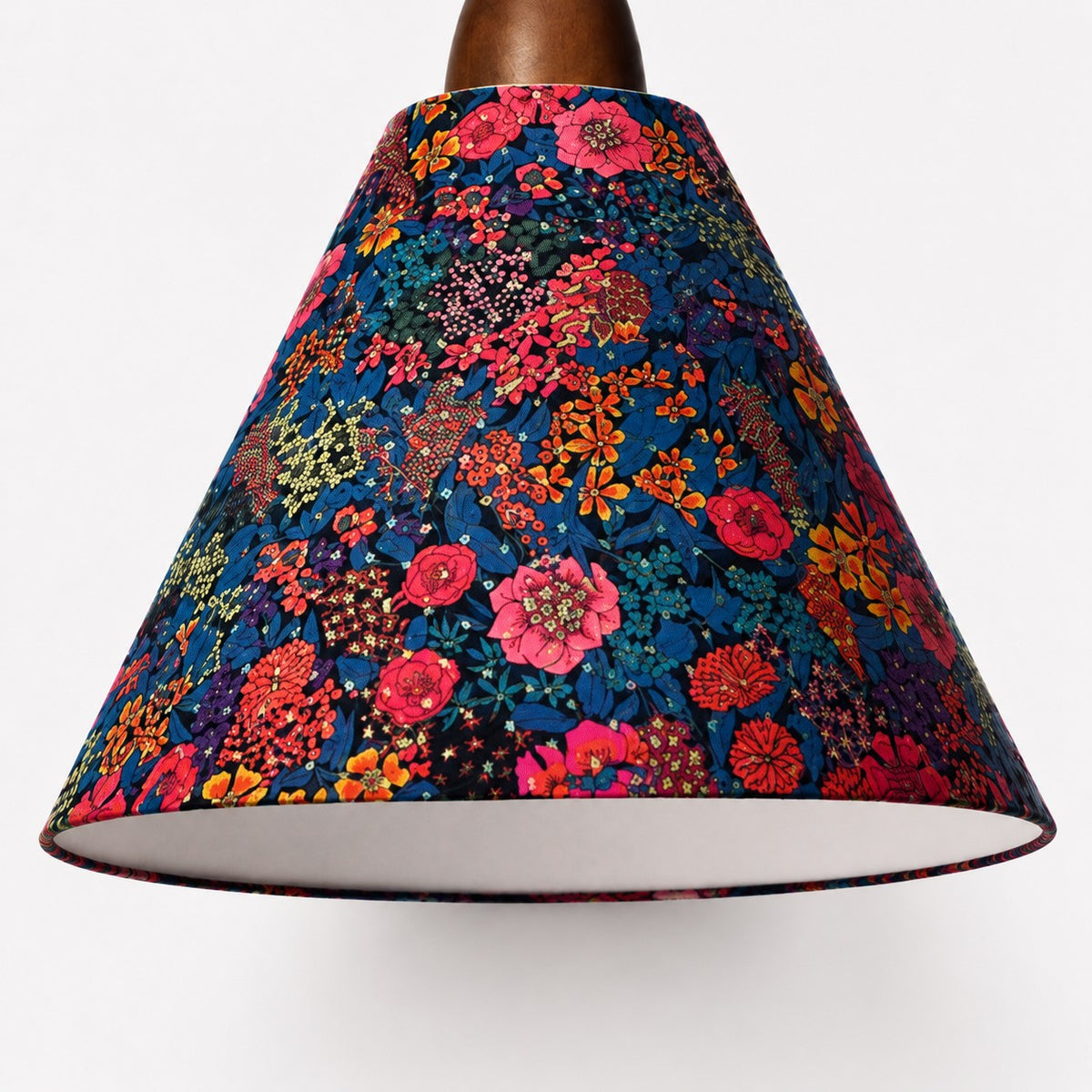 Close-up of dense botanical Liberty fabric texture and finished shade edge