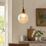 Cargar imagen en el visor de la Galería, brass crackle glass pendant light glowing beside a bright window
