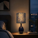 Afbeelding laden in galerijweergave, Blue gold patterned table lamp in a warm bedroom setting