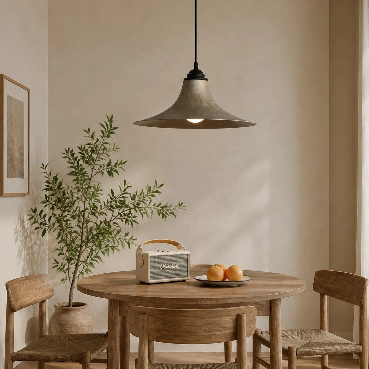 Black iron pendant lamp in a styled dining nook