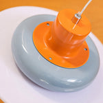 Załaduj obraz do przeglądarki galerii, Close-up of glossy orange top and sea salt blue shade detail