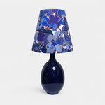 Afbeelding laden in galerijweergave, Blue floral fabric ceramic table lamp on plain background