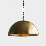Load image into Gallery viewer, Antique brass dome pendant light on a clean white background