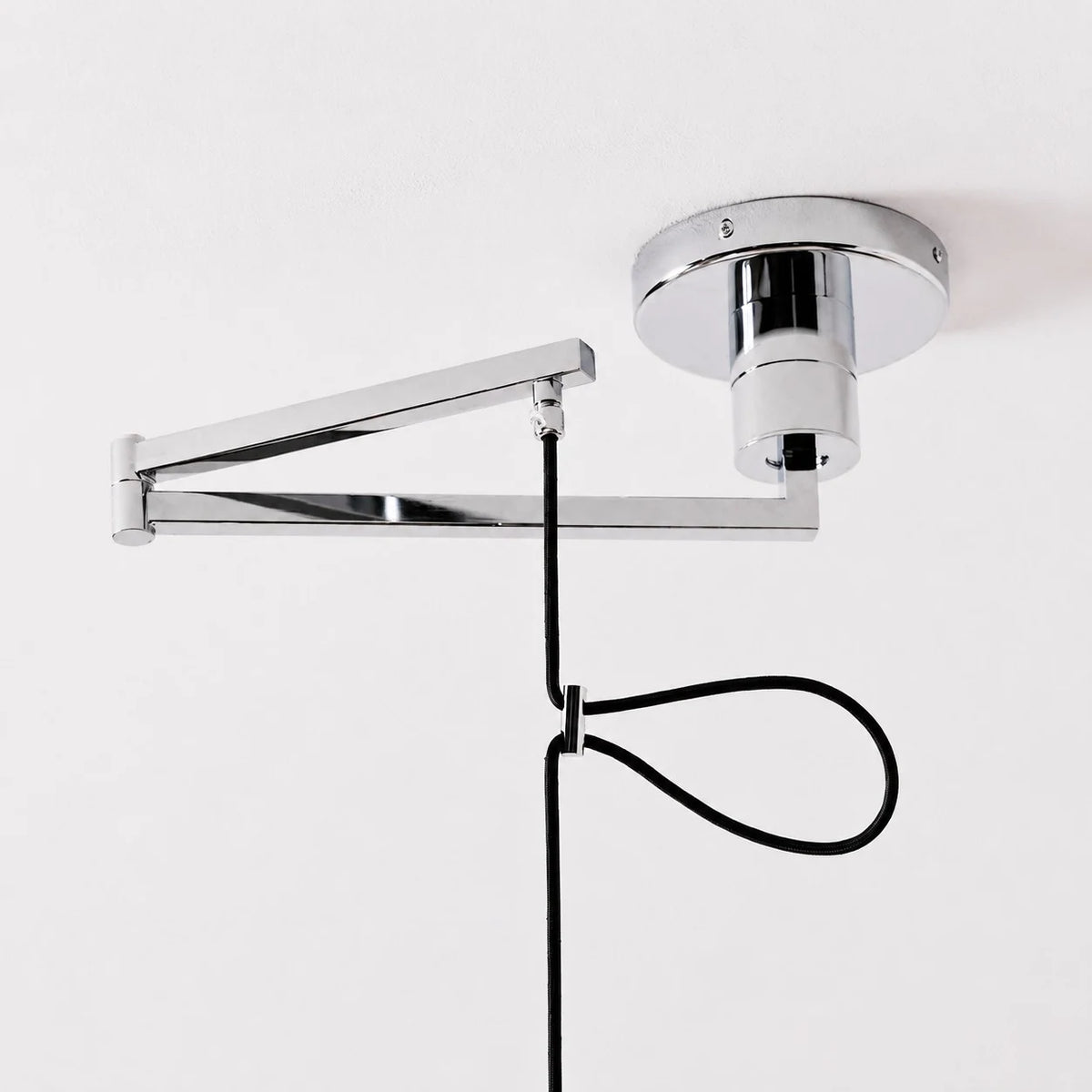 Adjustable arm, ceiling canopy, and hanging cable detail