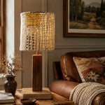 Cargar imagen en el visor de la Galería, Yellow patch loofah table lamp lit on a wooden table