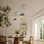 Cargar imagen en el visor de la Galería, Chrome pendant lights in a sunlit Bauhaus inspired dining room