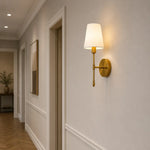 Carica l'immagine nella visualizzazione Galleria, Vintage brass wall light installed in a European-style interior