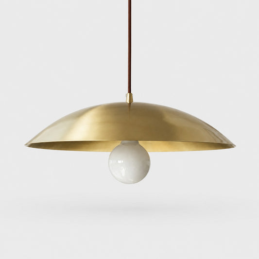 Brushed brass-finish dome pendant light on a neutral background