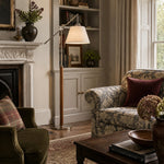 Bild in die Galerieansicht laden, Swing arm fabric floor lamp near a fireplace seating area