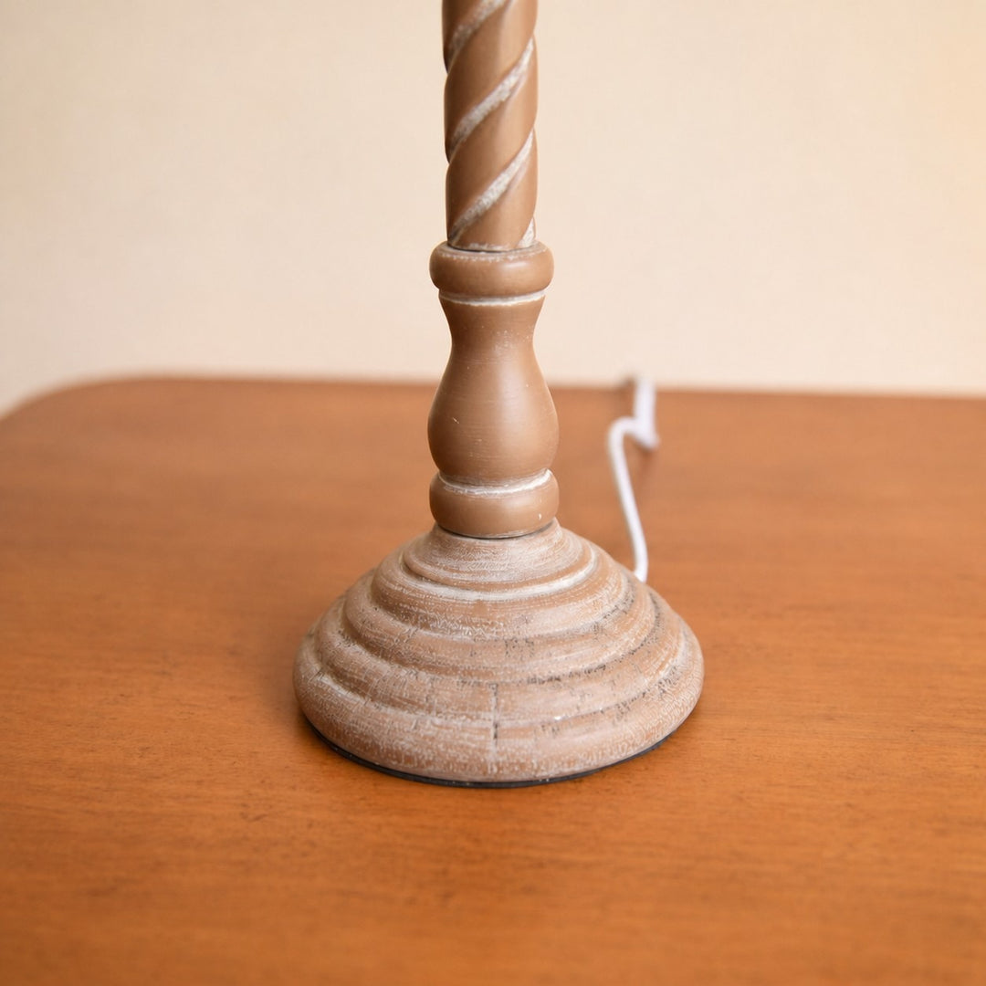 Carved wooden table lamp base close detail