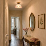 Cargar imagen en el visor de la Galería, ruffled glass flush mount ceiling light in a narrow hallway