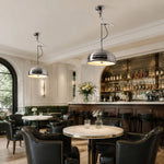 Cargar imagen en el visor de la Galería, Chrome pendant lights above a restaurant dining table