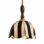 Cargar imagen en el visor de la Galería, Black and ivory striped fabric pendant lamp with warm light on